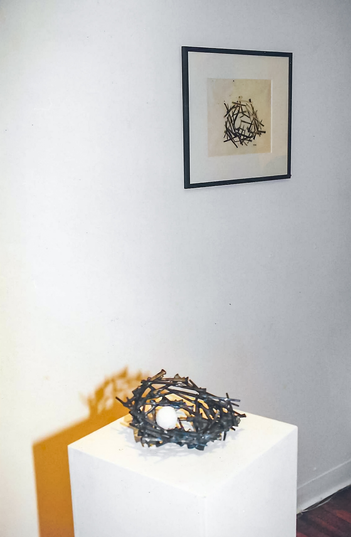 Alt text: Nail nest with paper mache egg