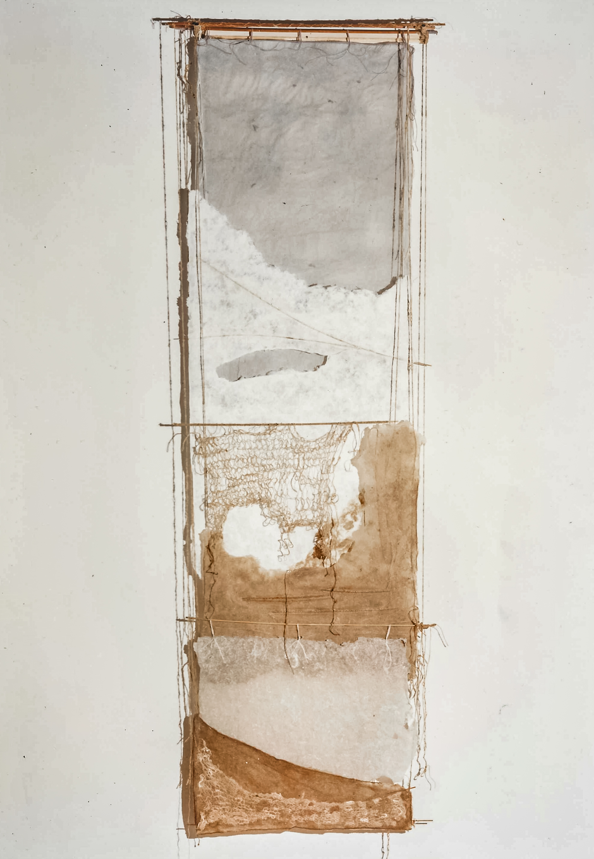 Alt text: Wall hanging of handmade paper