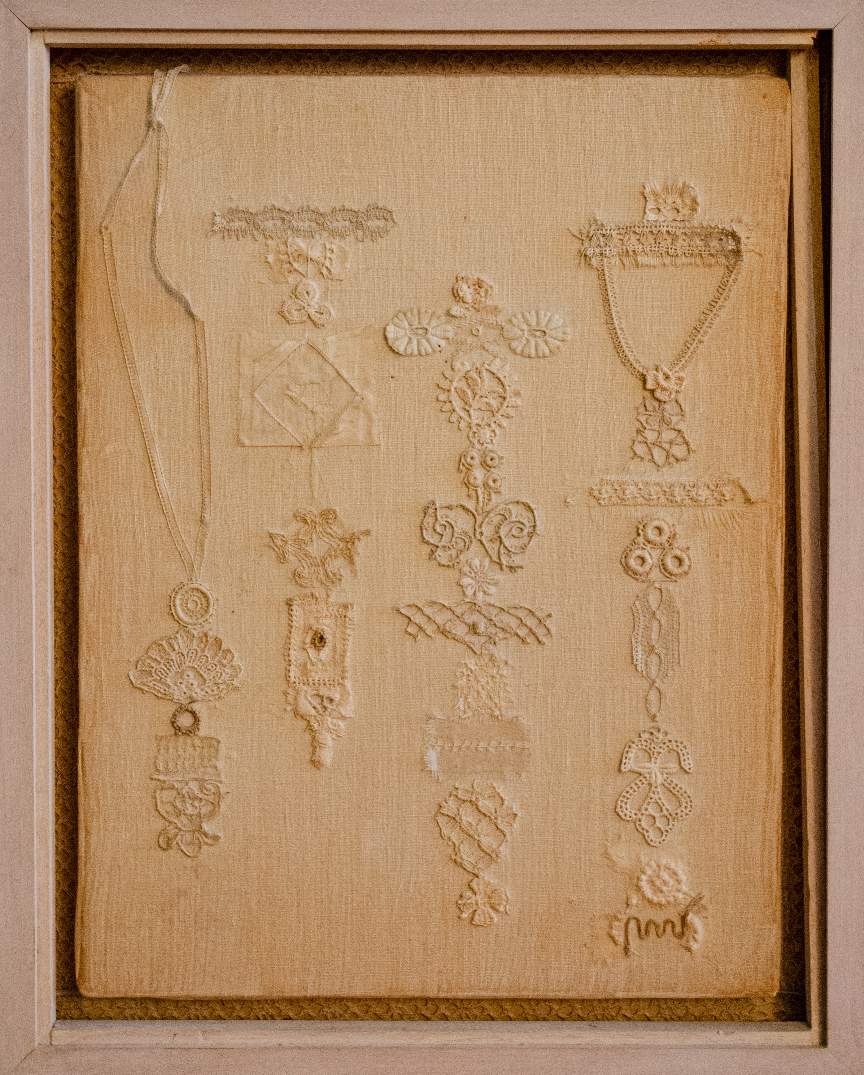 Alt text: Cloth collage with medal motifs