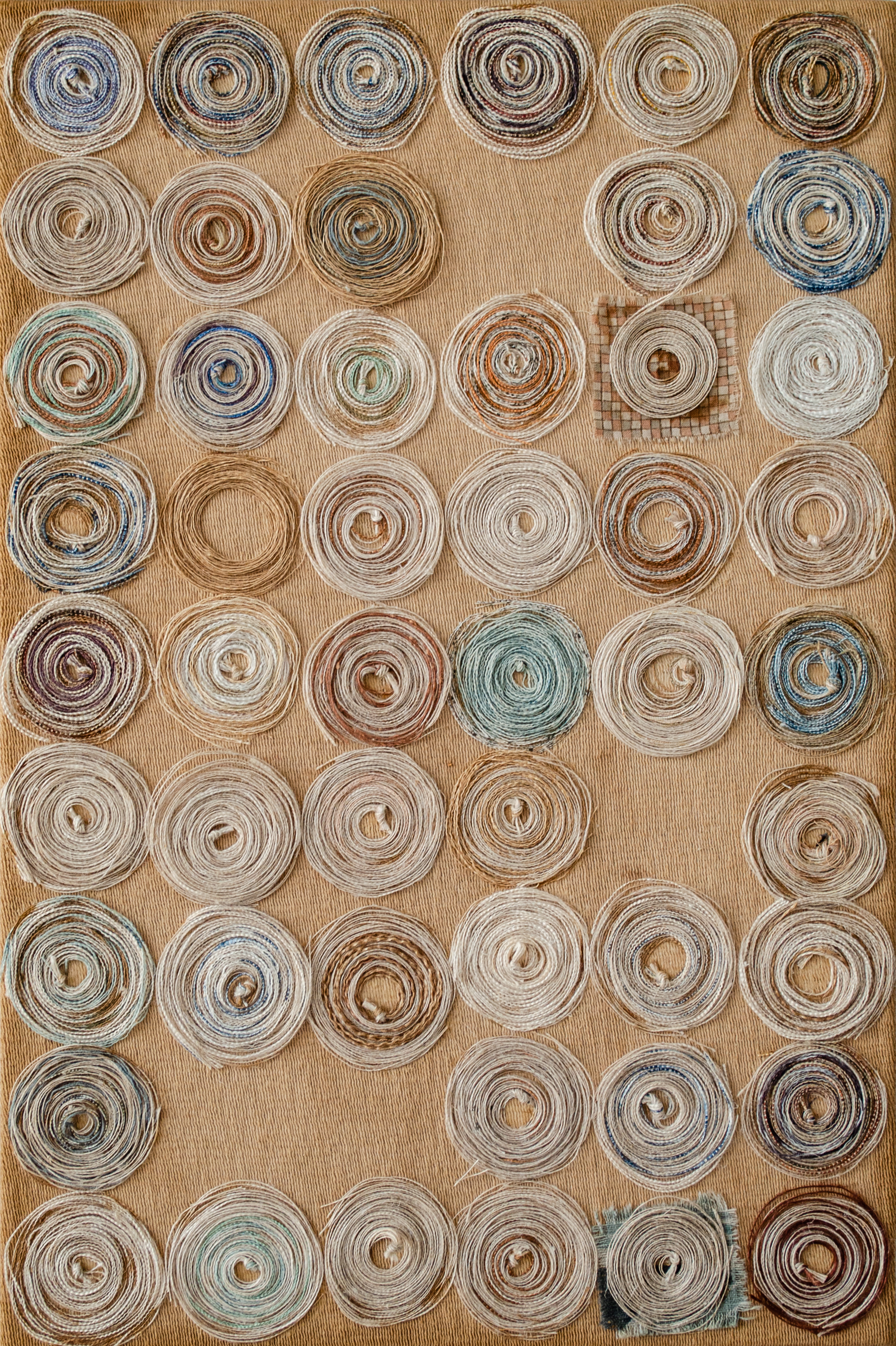 Alt text: collage of wound thread on canvas