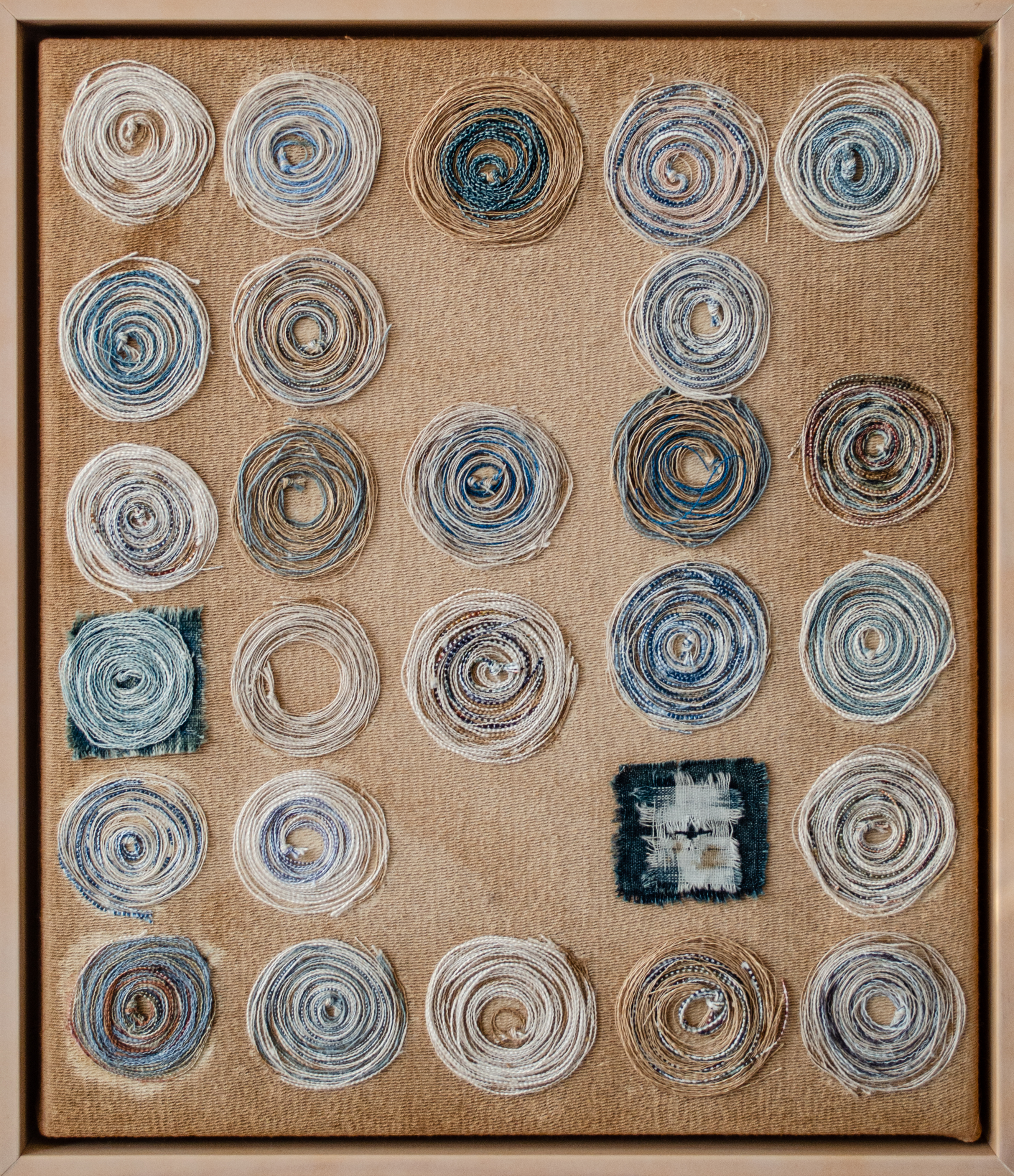 Alt text: collage of wound thread on canvas