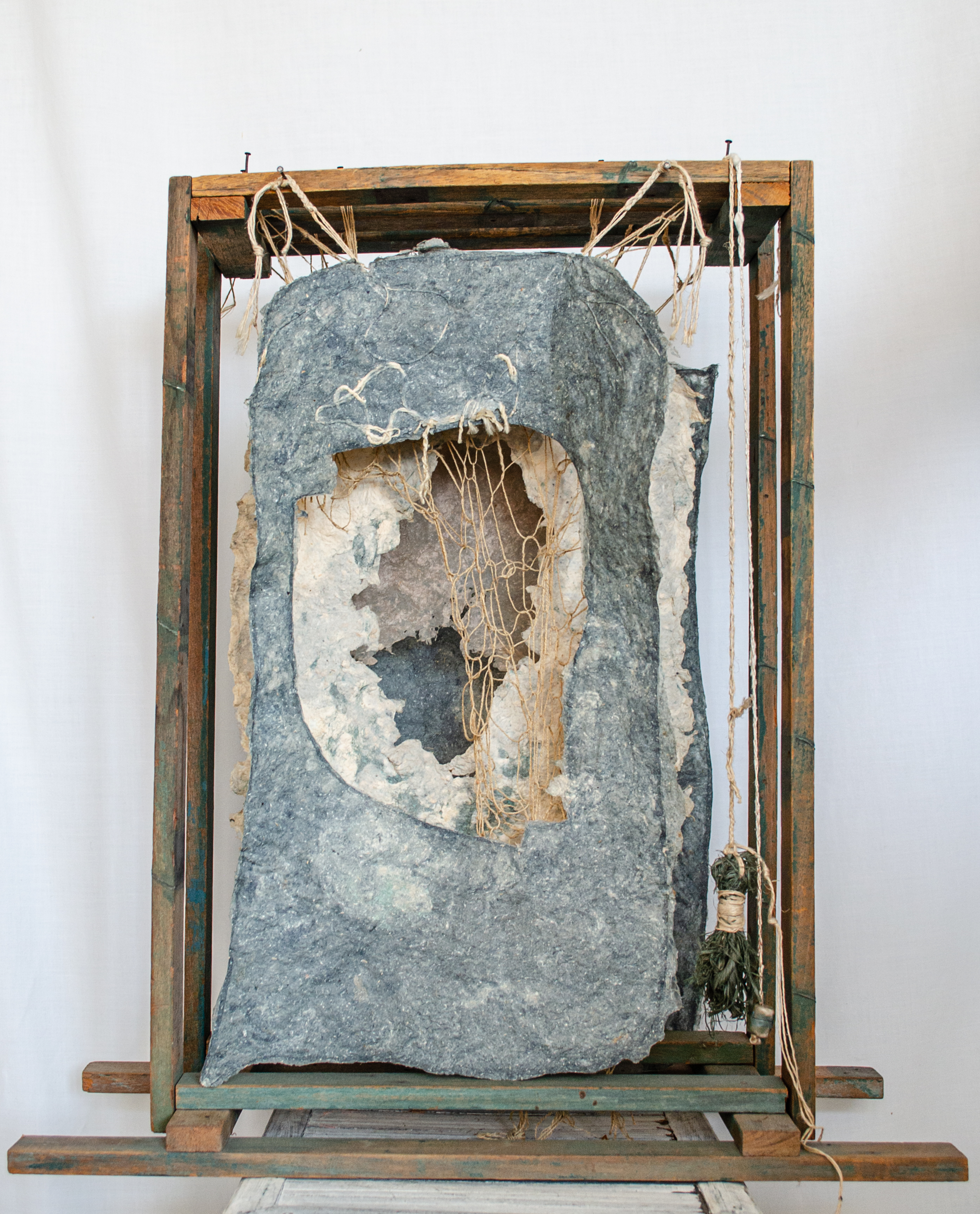 Alt text: wood and flax paper sculpture construction