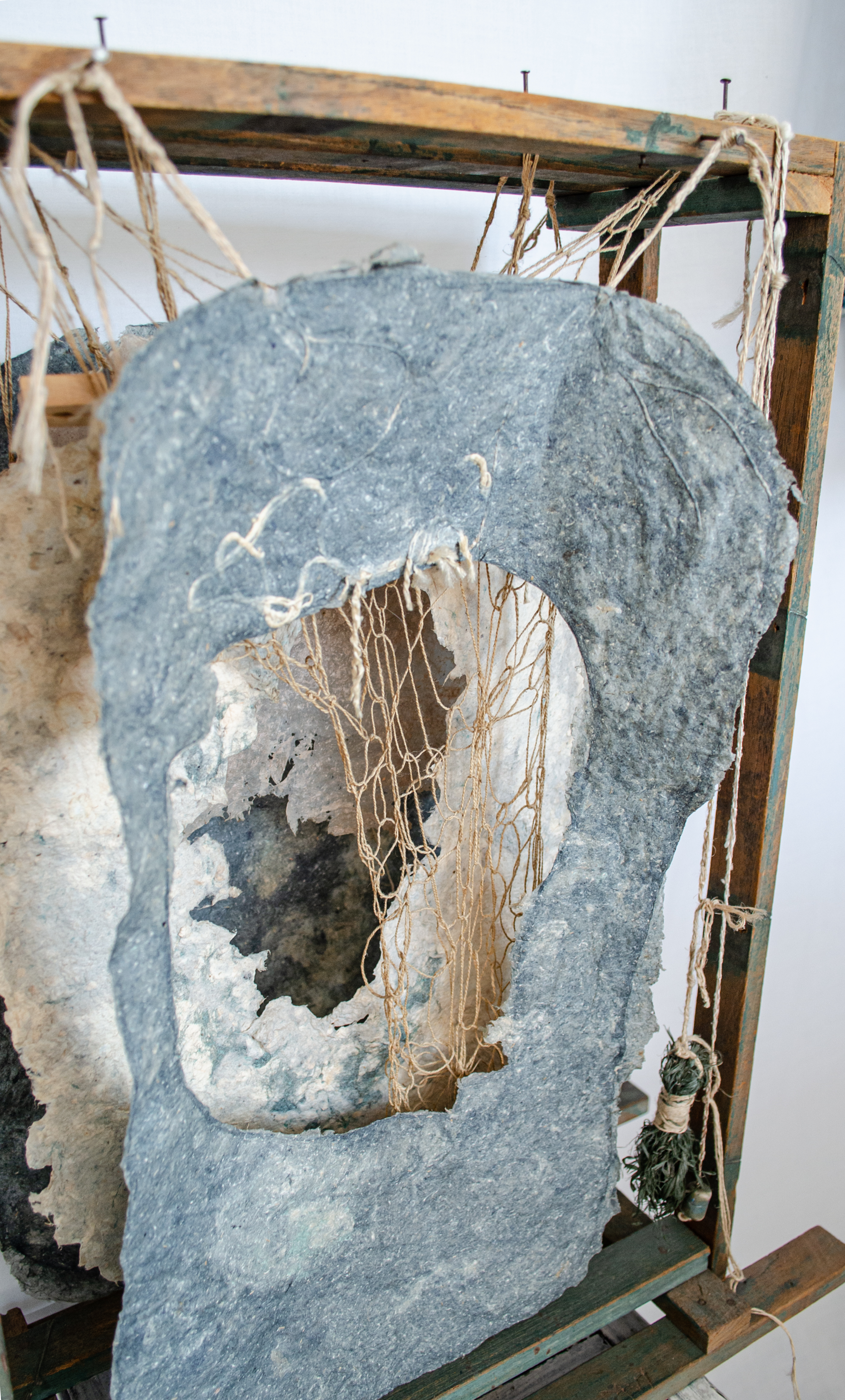 Alt text: detail of wood and flax paper sculpture construction