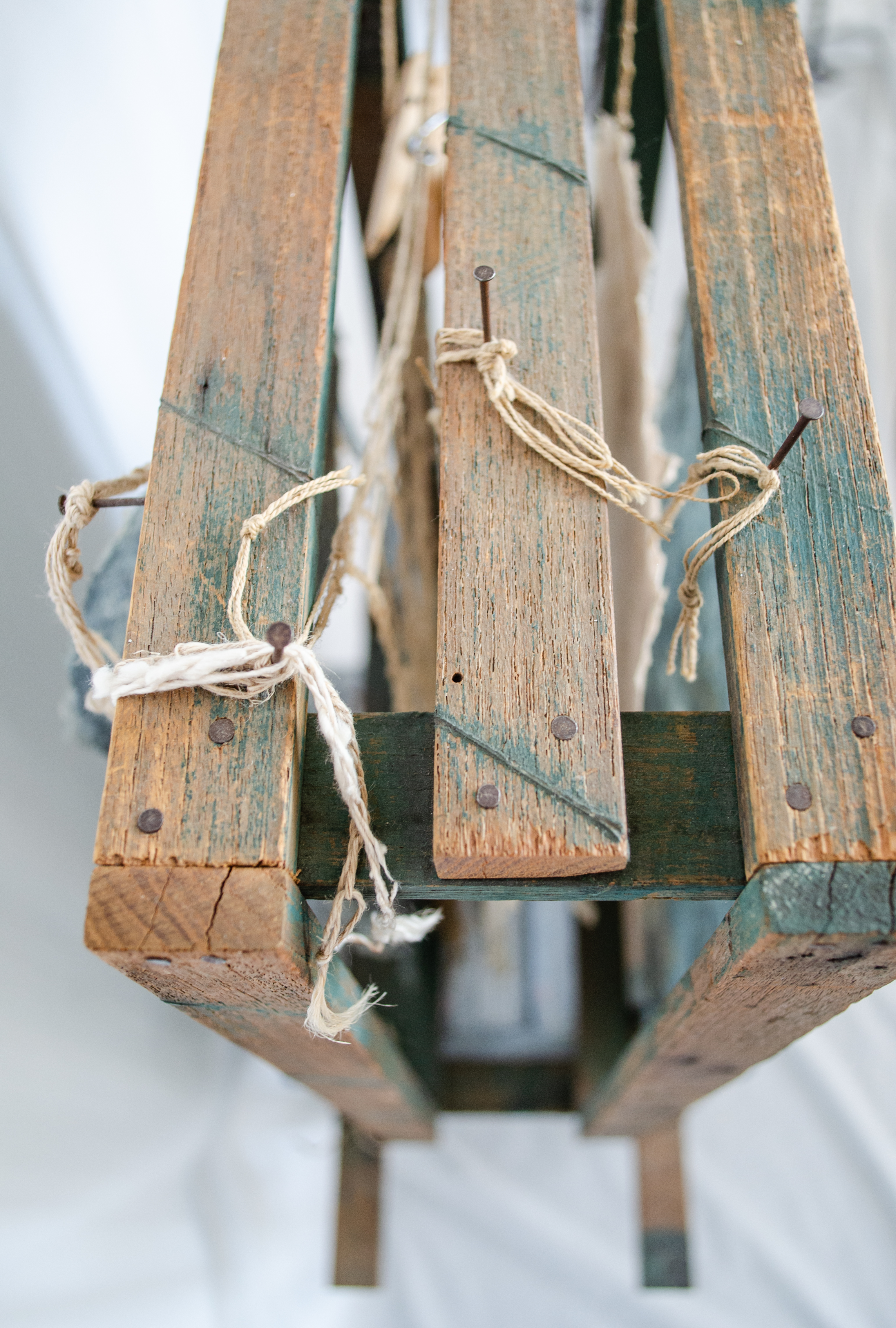 Alt text: detail of wood and flax paper sculpture construction