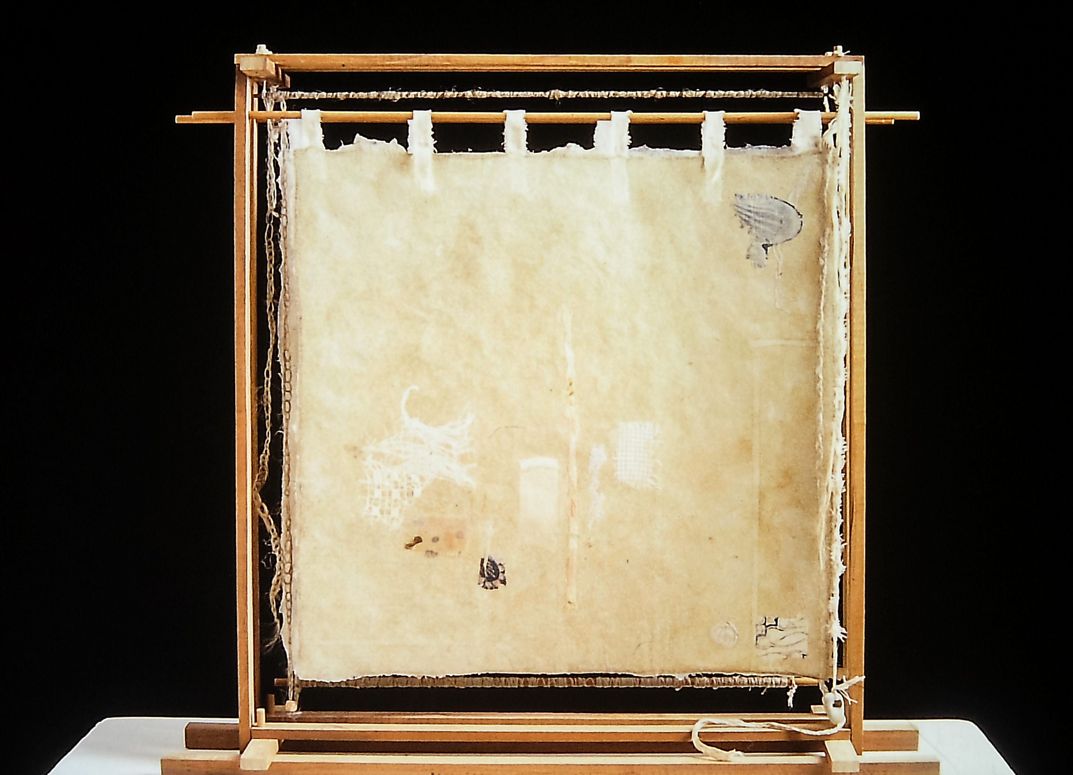 Alt text: detail of wood and flax paper sculpture construction