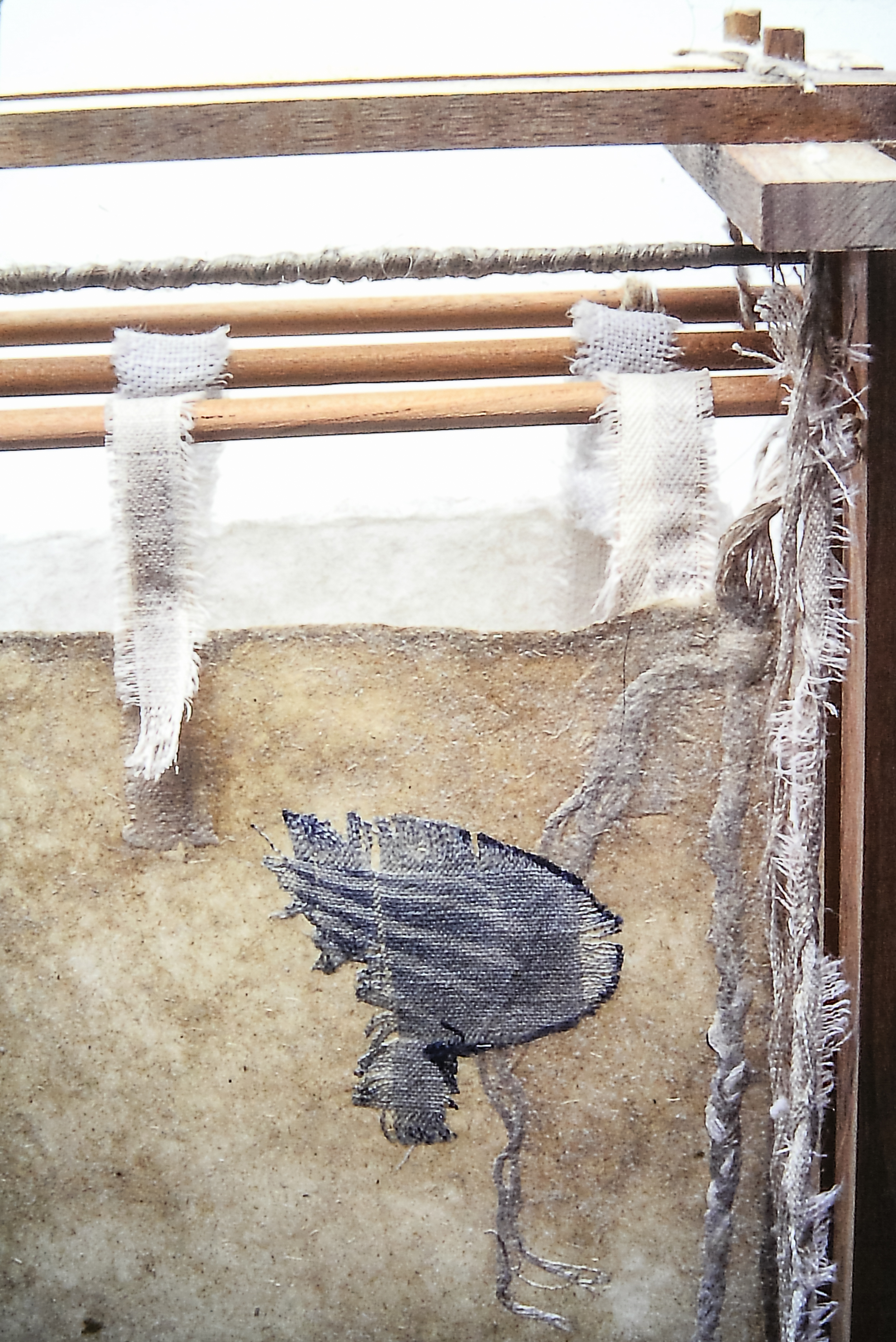 Alt text: detail of wood and flax paper sculpture construction