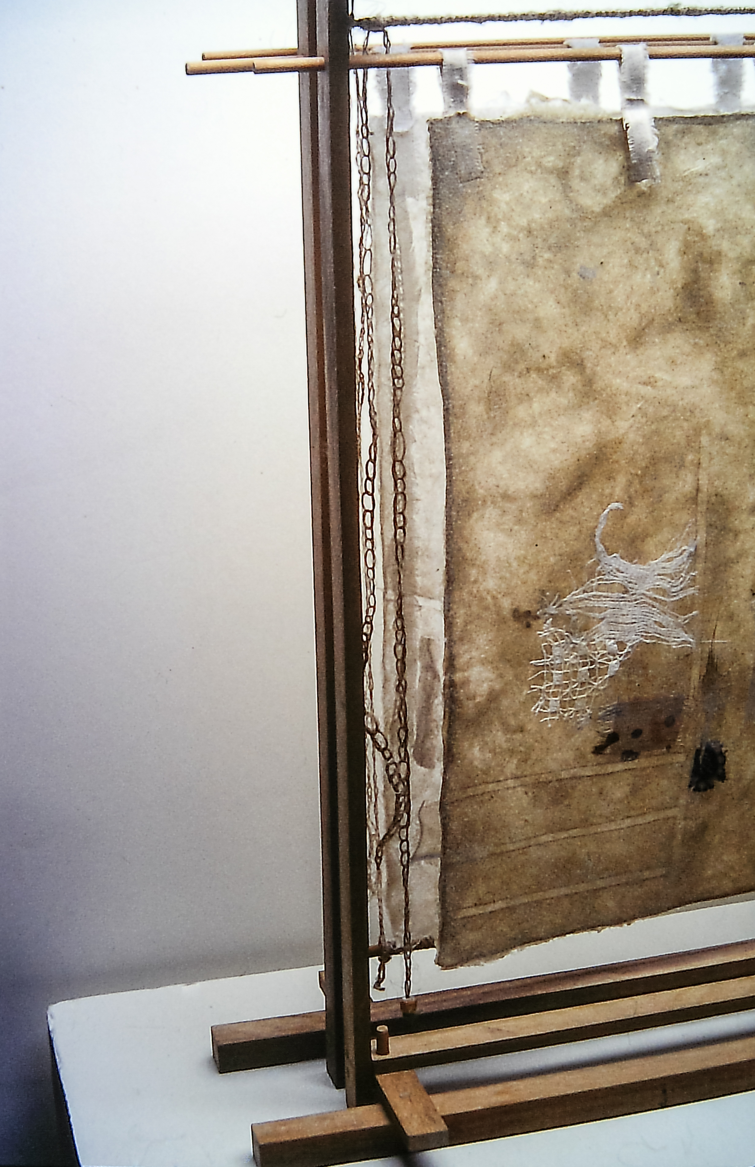 Alt text: detail of wood and flax paper sculpture construction