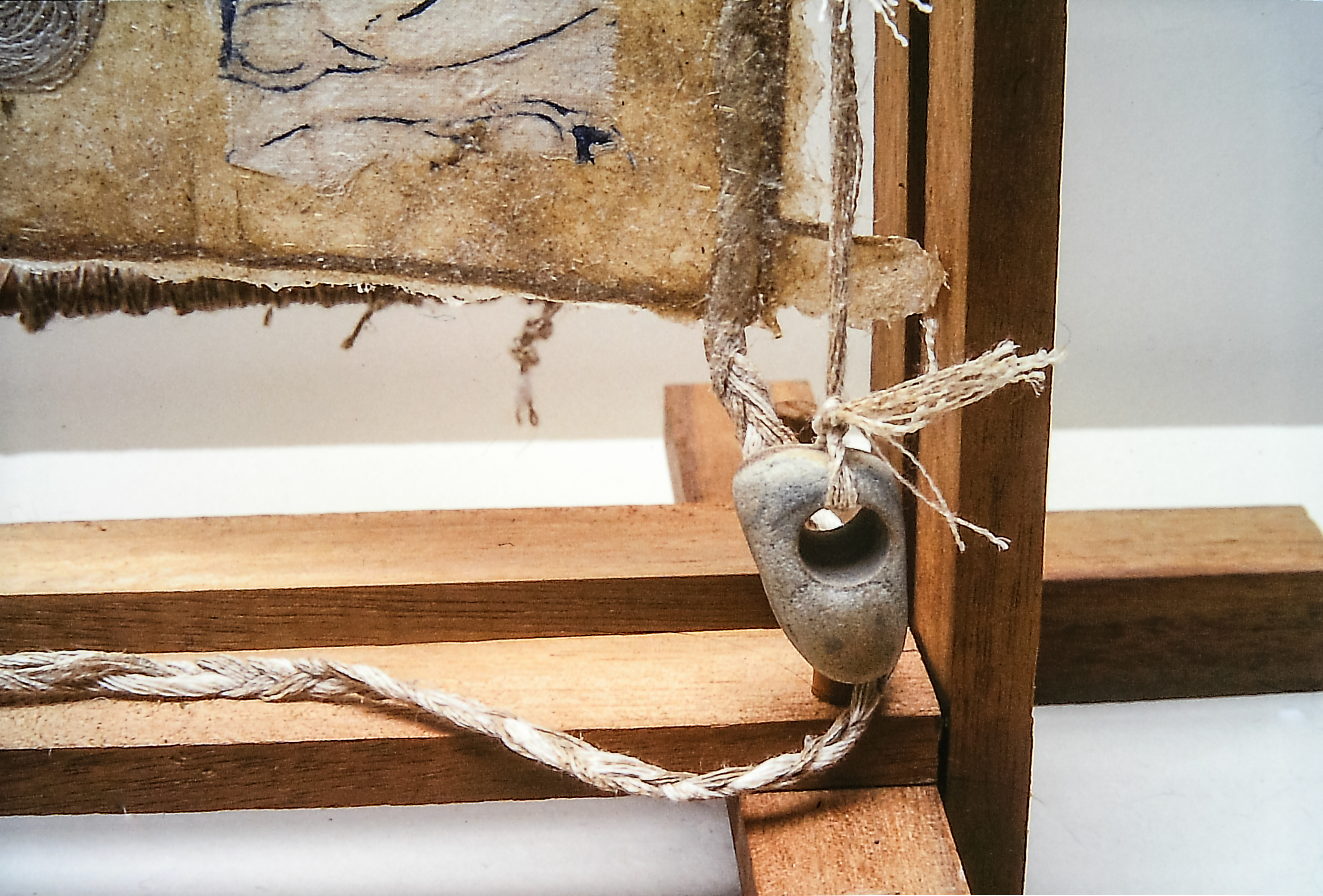 Alt text: detail of wood and flax paper sculpture construction