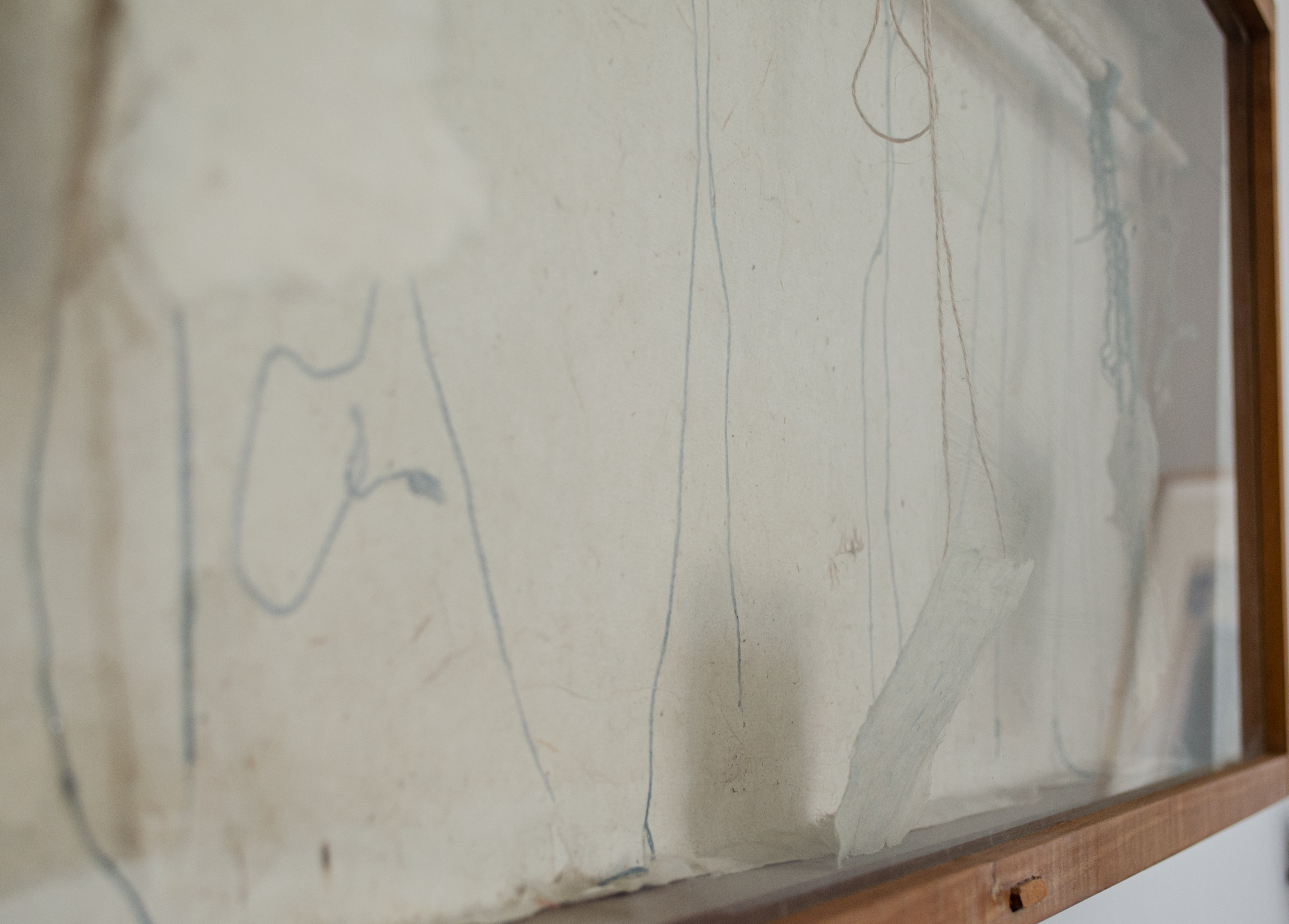 Alt text: Cupboard with strings and handmade paper