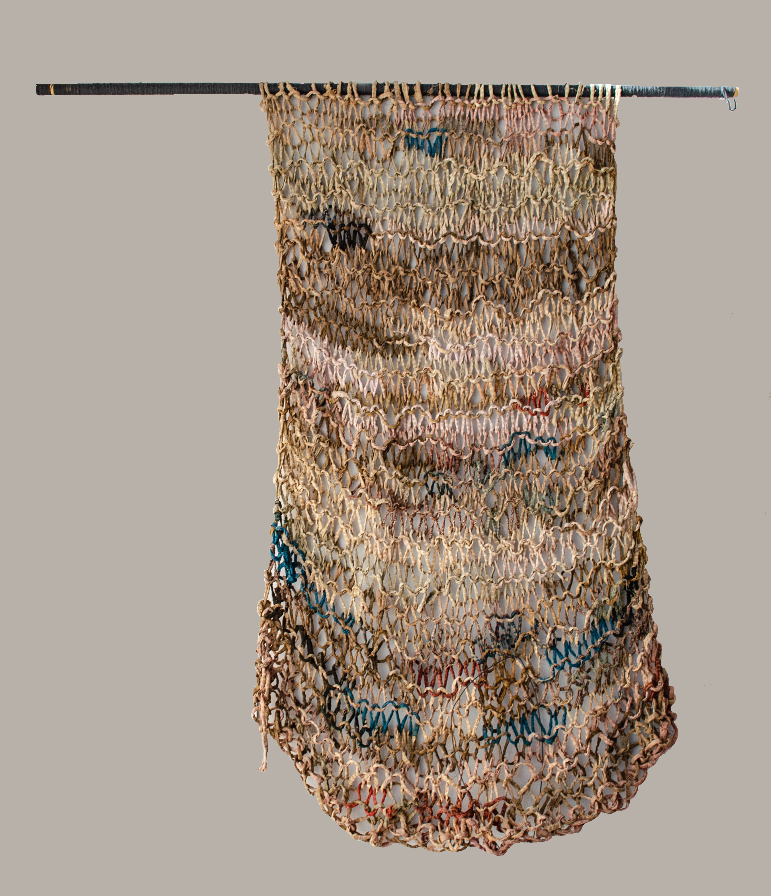 Alt text: Knitted handmade wall hanging