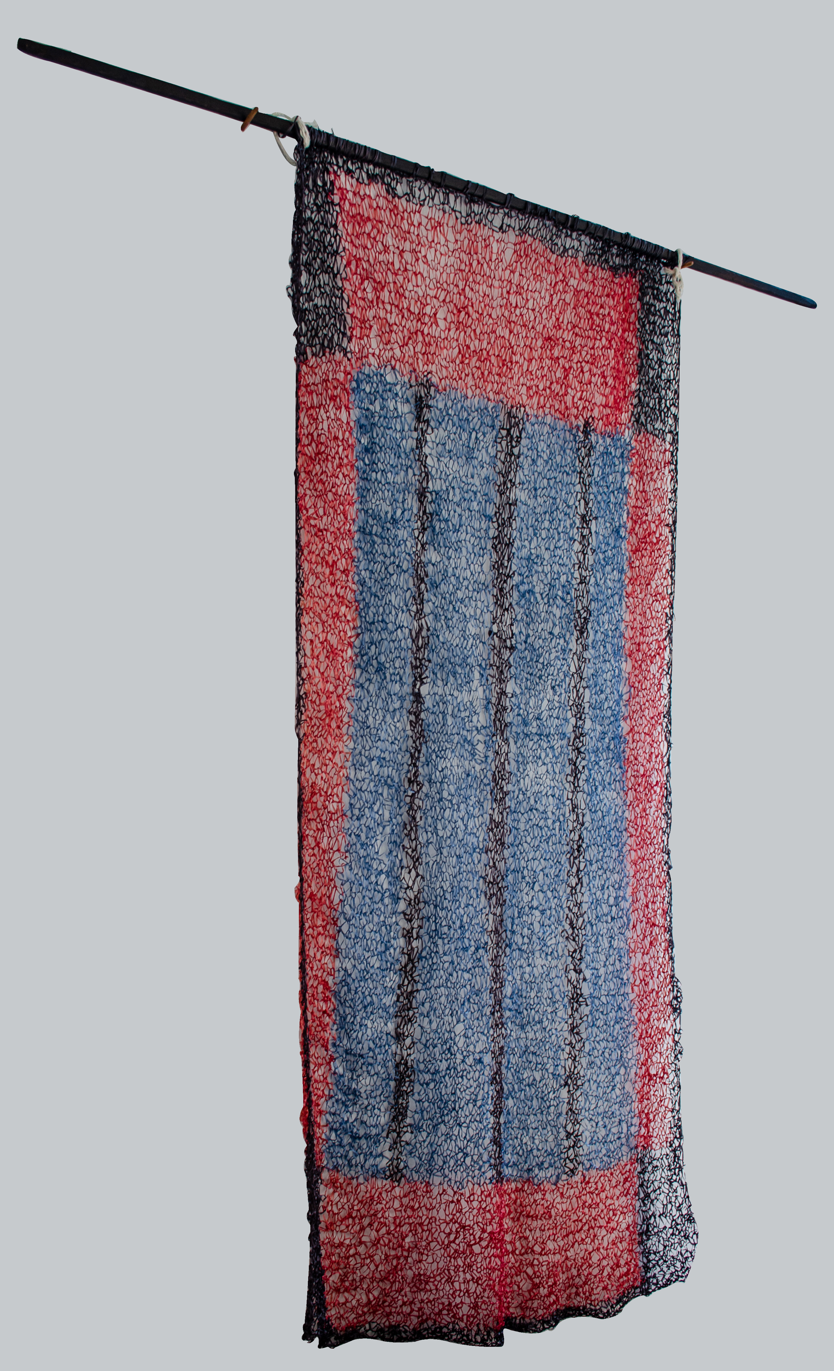 Alt text: Knitted handmade wall hanging