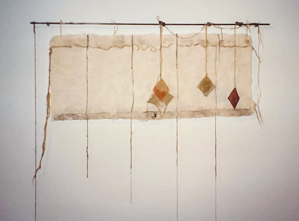 Alt text: Handmade paper wall hanging