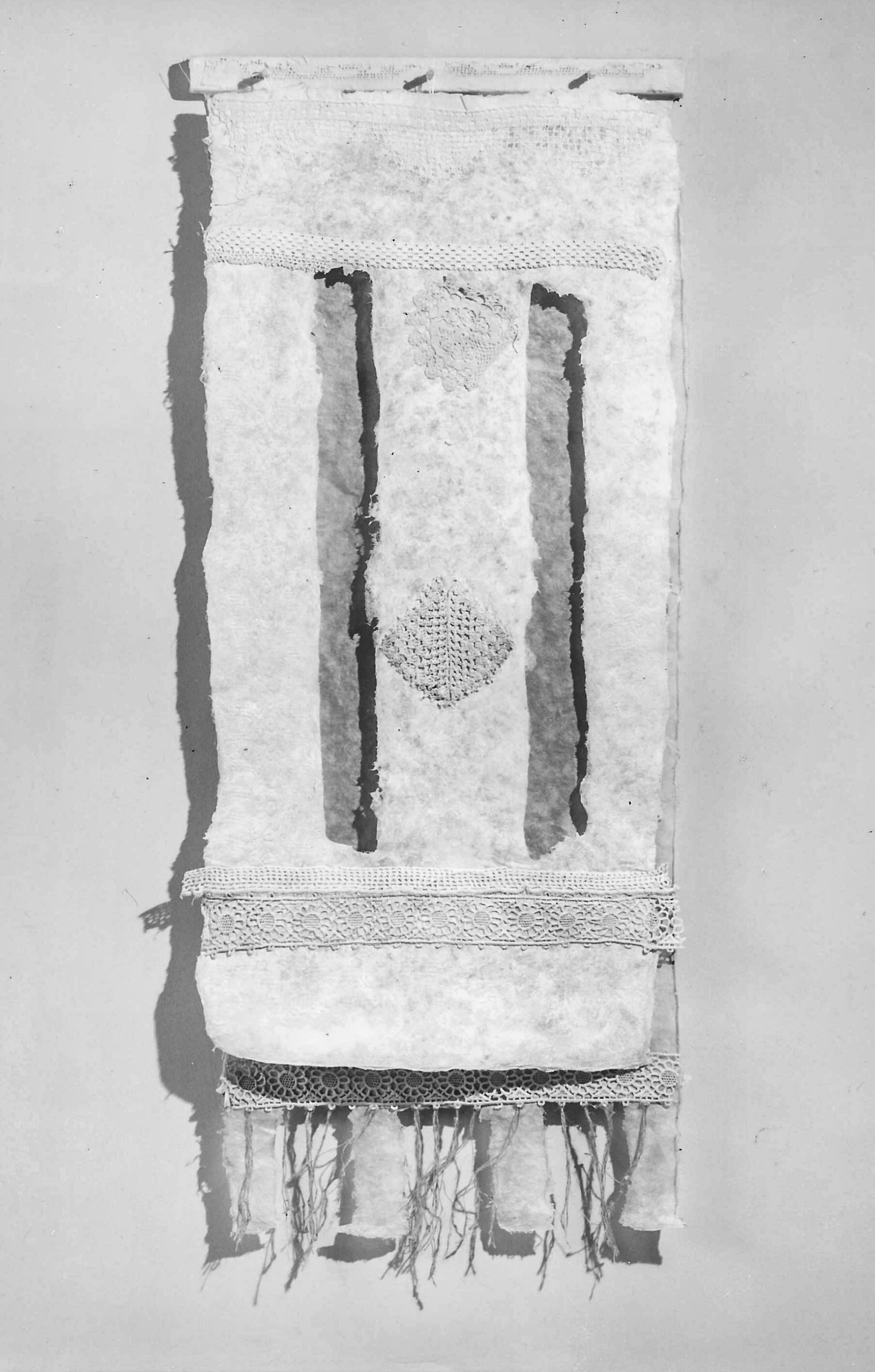 Alt text: Handmade paper wall hanging