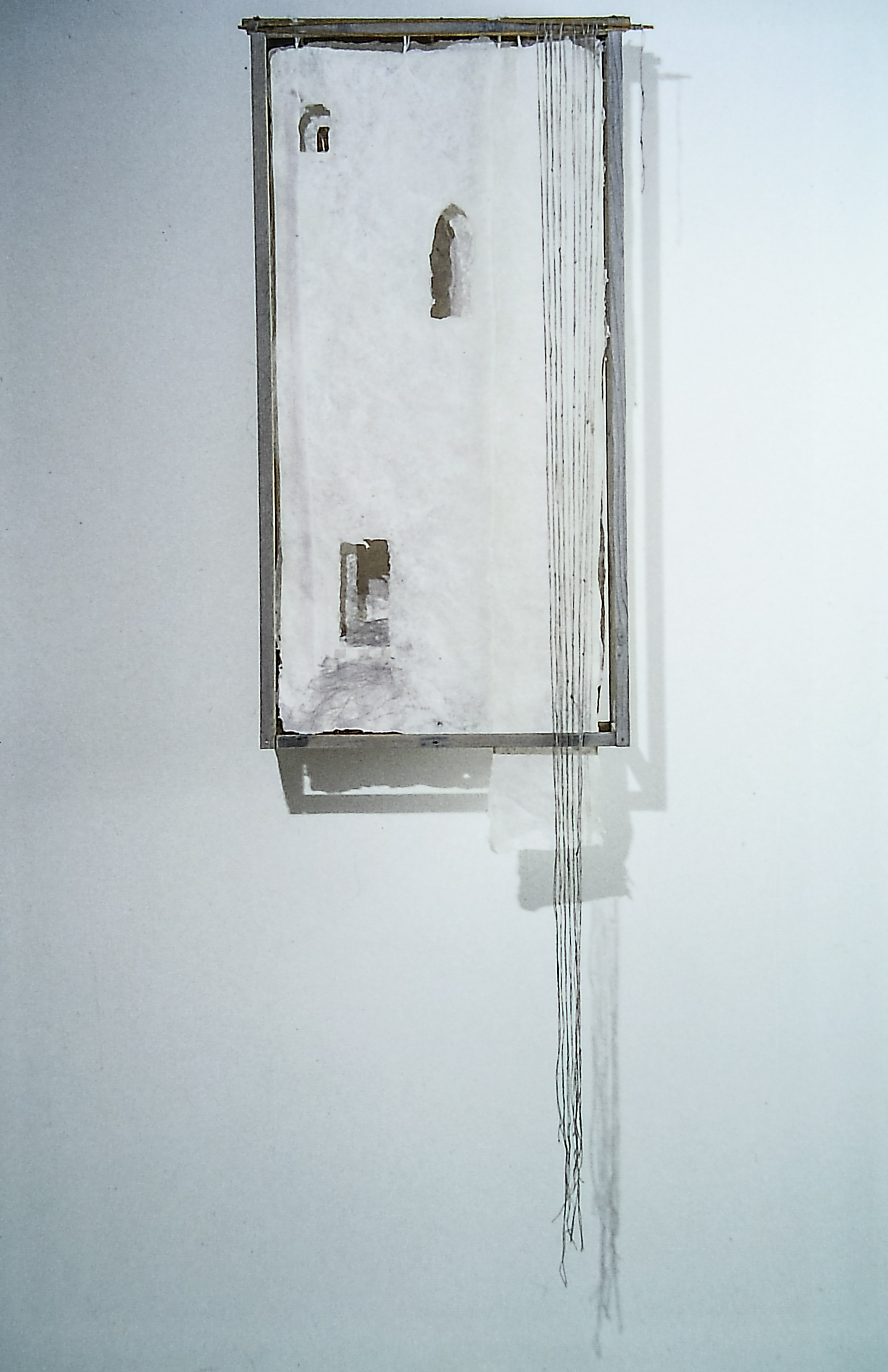 Alt text: Sculptural door construction with handmade paper