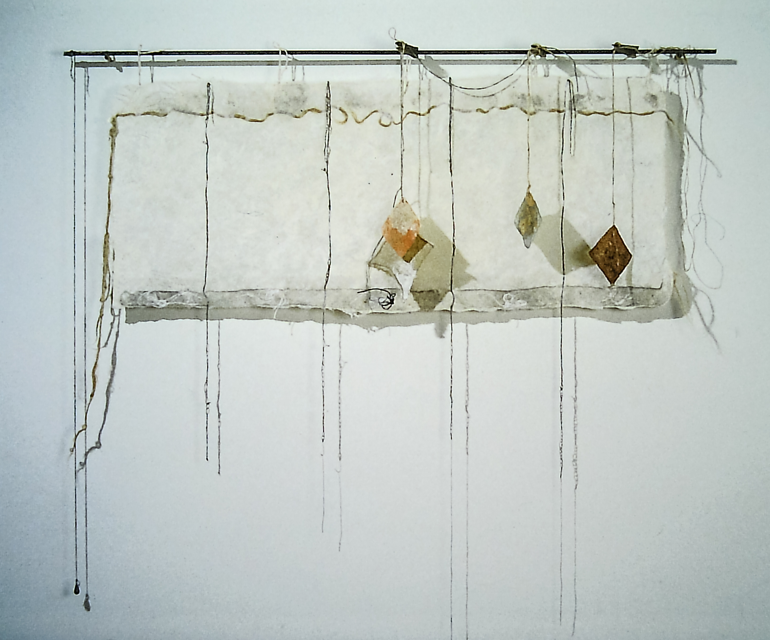 Alt text: Handmade paper wall hanging